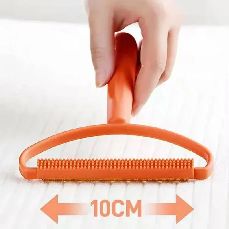 Using portable lint remover to clean pet hair from clothes