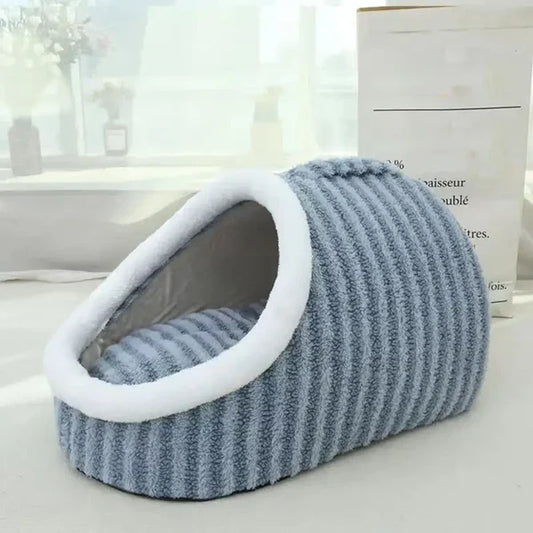 Cat relaxing inside a soft slipper-shaped pet cave bed with plush interior for warmth and comfort