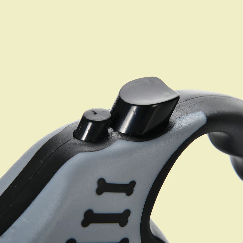 Close-up of locking button mechanism on retractable leash
