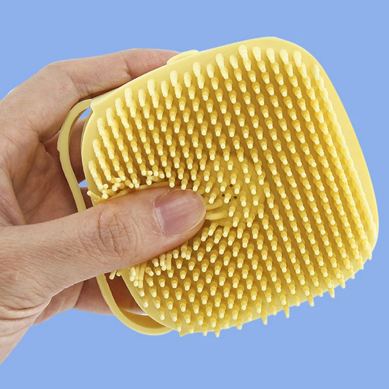 Bathing dog with silicone massage glove

