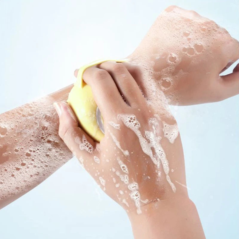 Using pet bath gloves to massage and clean dog fur

